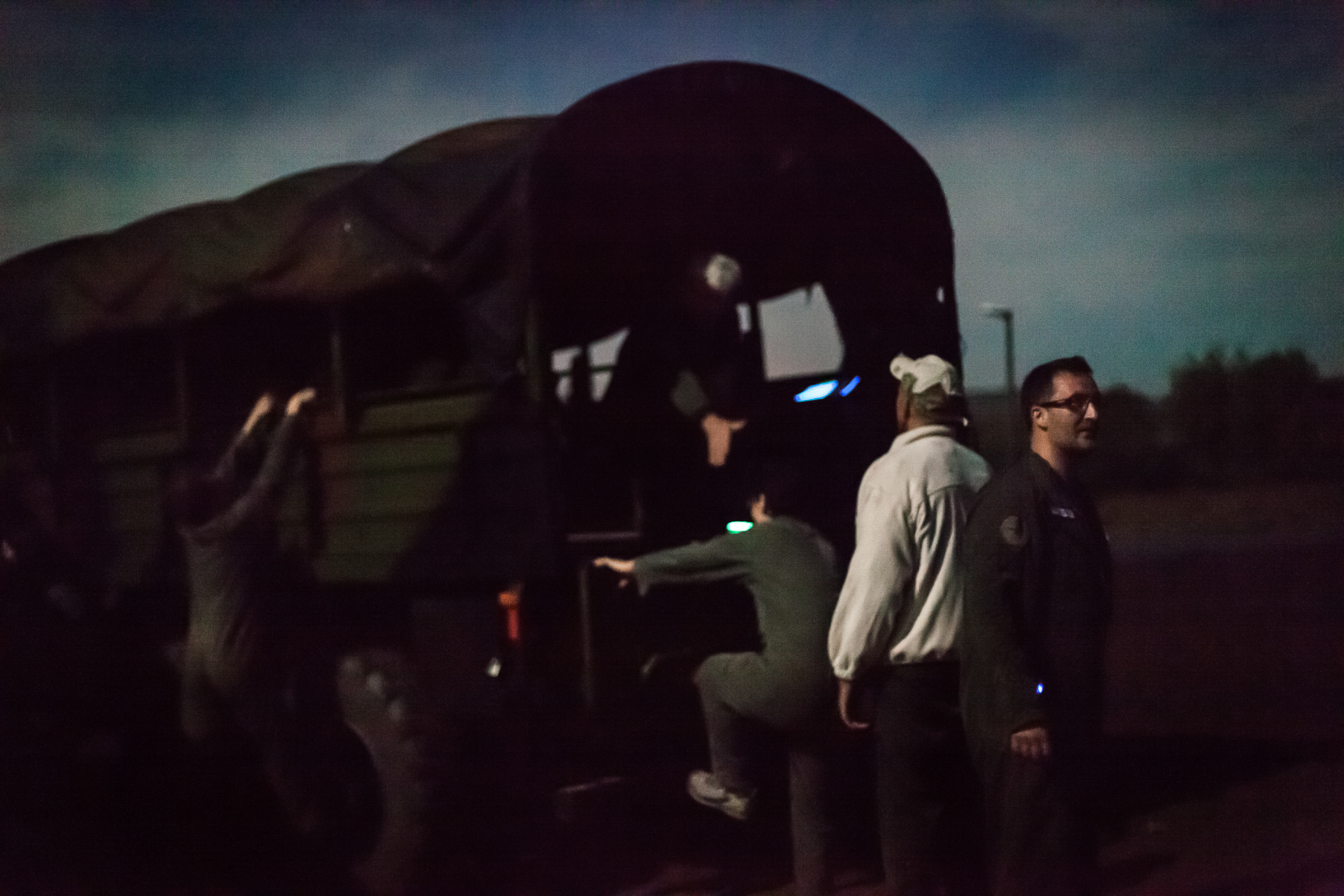 Coëtquidan, le 17 Octobre 2013. Après le dîner, les cadres de Veolia venus suivre un stage de leadership à Saint-Cyr partent au clair de lune faire un exercice nocturne sur un terrain d'entraînement militaire.

Coëtquidan, October 17, 2013. After dinner, Veolia executives following a leadership course at Saint-Cyr military school, make a night exercise at a military training ground.